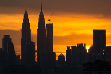 A majestic sunset in Kuala Lumpur, the capital of Malaysia. Its modern skyline is dominated by the 451m tall KLCC, a pair of glass and steel clad skyscrapers.