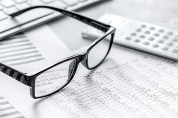 business accounter work with taxes and calculator on office desk