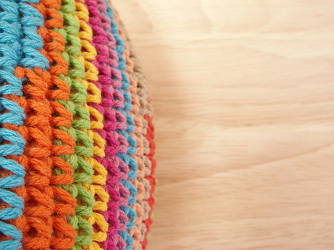 colorful crochet on parawood background