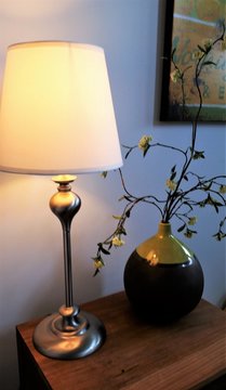 Lanp and flower in vase still life