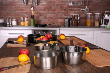 Kitchenware for cooking classes on wooden table