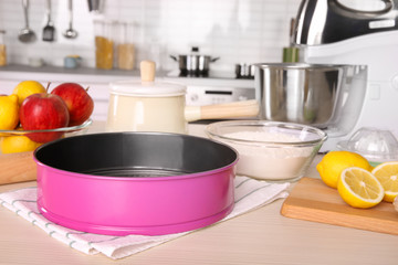 Kitchenware for cooking classes on wooden table