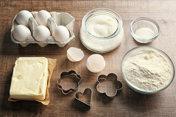 Ingredients for preparing butter cookies on kitchen table