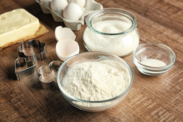 Ingredients for preparing butter cookies on kitchen table