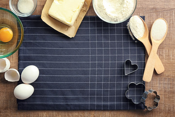 Ingredients for preparing butter cookies on kitchen table