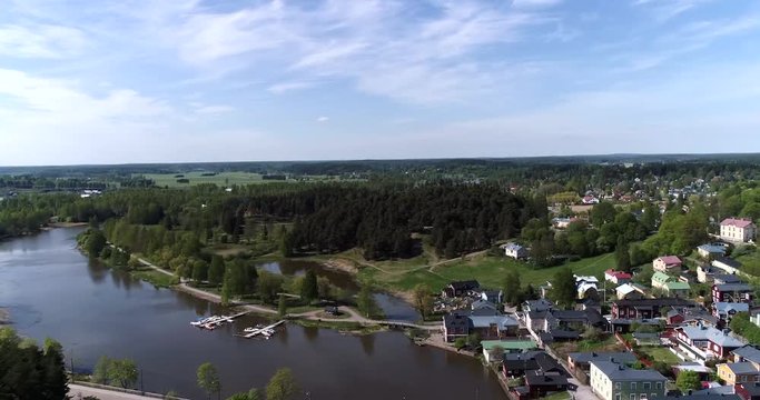 Porvoo, Cinema 4k aerial view above porvoonjoki and towards linnanmaki hill in Borg&aring;, Uusimaa, Finland
