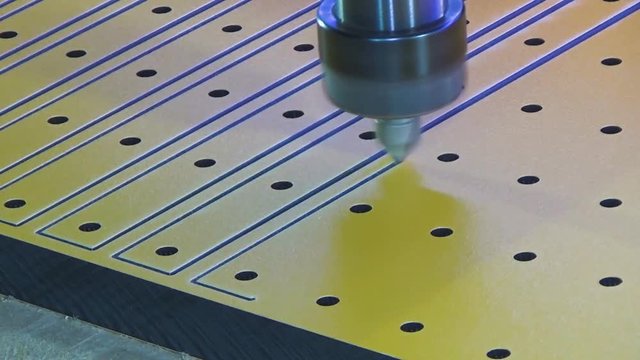 Milling cnc cuts the plastic panel hpl. NC spindle with milling cutter for marking.
