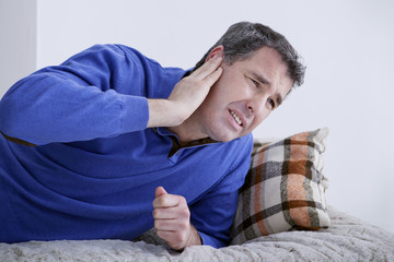 Man suffering from earache