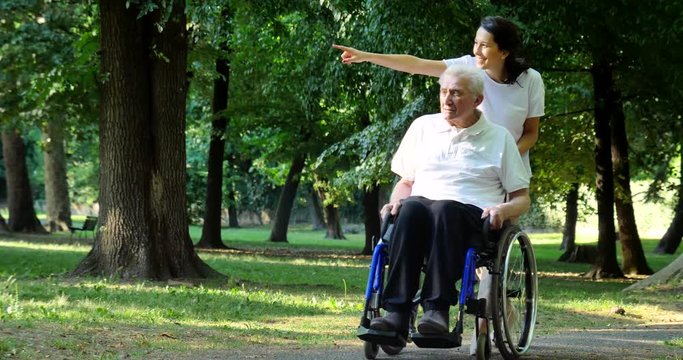 Granddaughter, nurse, caring for the elderly, girl (woman), grandfather, happy, freedom, running around in the park. Concept boarding house, a sanatorium, a house for the elderly, help for the elderly