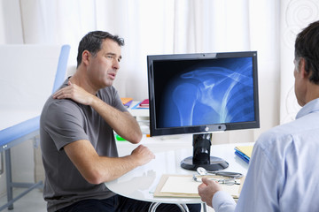 Male patient consulting for shoulder pain