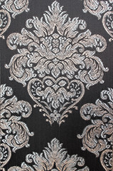 A damask upholstery fabric. A vintage pattern