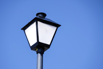 Fototapeta na wymiar street light against blue sky