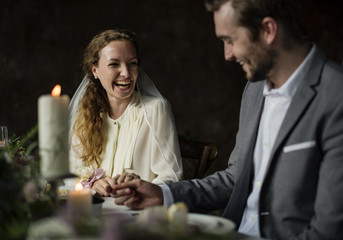 Bride and Groom Holding Hands on Wedding Reception