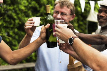 Group of men drinking local red wine together