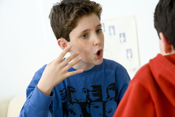 Models Do not use for HIV A young boy and his brother using the French sign language to discuss with his hearing-impaired brother The French sign language uses signs to designate words but also dactylology (each letter of the alphabet is represented by a defined position of the fingers then enabling to spell a word) and the lip reading The young boy designates the word \code\ © RFBSIP