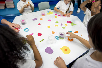 Kindergarten students learning shape with colorful clay