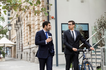 Young businessmen with a bike