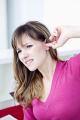 Woman suffering from earache