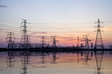 The silhouette of high voltage towers