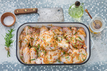 Fresh chicken legs with honey and herbs for grill