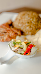 vegetable pickles with fried rice and meat as the background