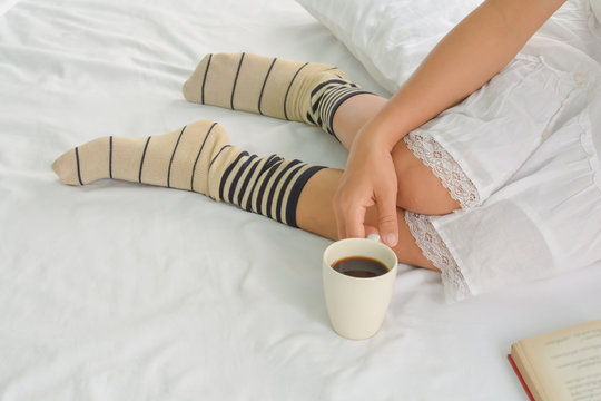 healthy women and coffe on bed in the morning
