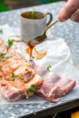 Preparing ribs in the summer garden for grill