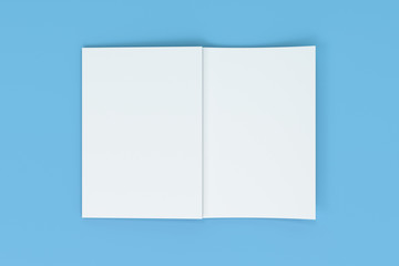 Mockup of blank white open brochure lying with cover upside on blue background