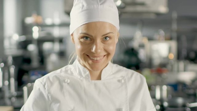 Beautiful Young Female Chef Smells Decorative Spice Plant.Shot on RED EPIC-W 8K Helium Cinema Camera.