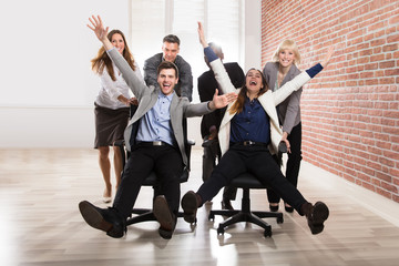 Carefree Businesspeople Making Fun In Office