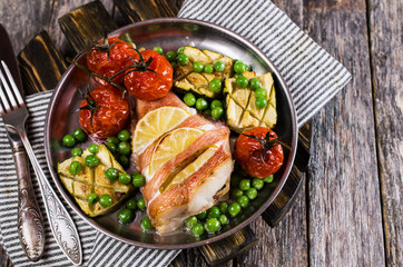 Baked fish with vegetables