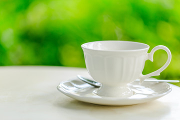 coffee cup during breakfast in morning sunlight