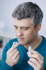 Man taking homeopathic medicine