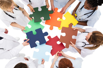 Medical Team Solving Jigsaw Puzzle