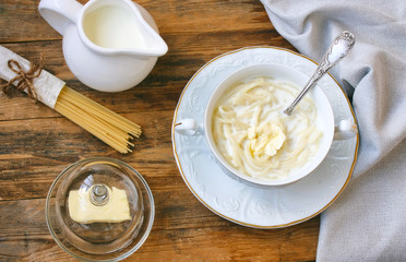 dairy noodles in white bowl on plate