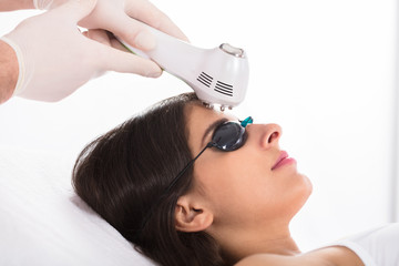 Naklejka premium Woman Getting A Ultrasound Skin Treatment
