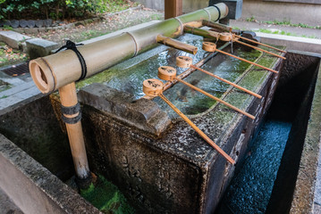 Purification fountain at the entrance of Yasaka-jinja Shrine