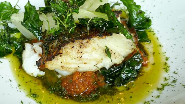Sea bass steak with sauce
