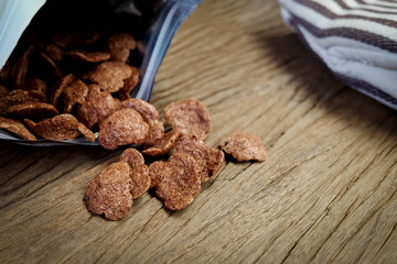chocolate cereals bag open on wood table