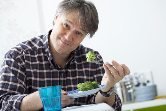 Man Eating Vegetable