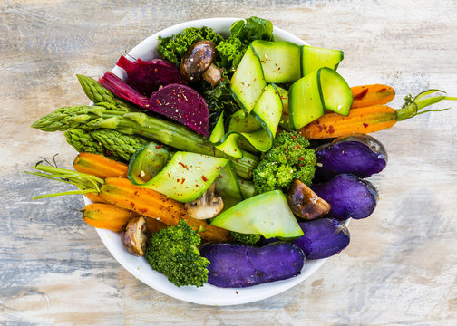 Delicious and healthy salad with colorful vegetables. Rainbow food.