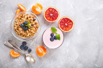 Healthy breakfast - muesli, yogurt and fruit. Selective focus. Copy space. Top view