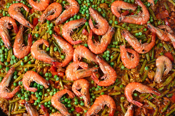 Paella with seafood and chicken. Prepared in wok.