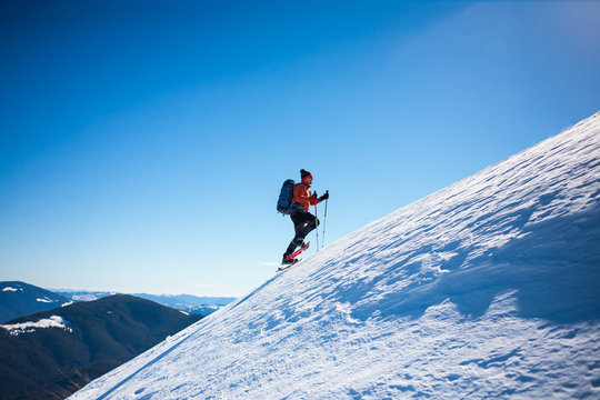 Climber in the winter mountains.