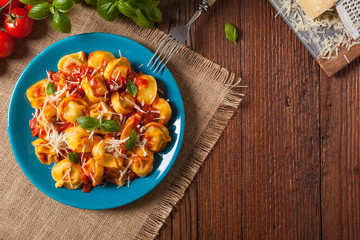 Delicious tortellini with meat in tomato sauce.