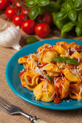 Delicious tortellini with meat in tomato sauce.