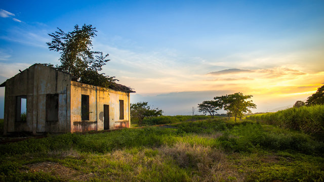 abandoned house with a beautiful sunset
