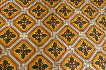 Colonial house architecture Vintage floor tiles with orange, green, white as a decorative design...