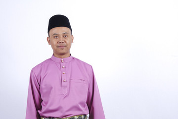 Man in traditional clothing, standing  celebrate Eid Fitr.