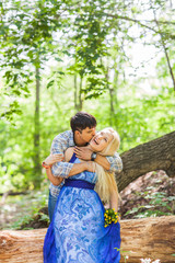 Naklejka premium Boy kissing his girlfriend on the cheek